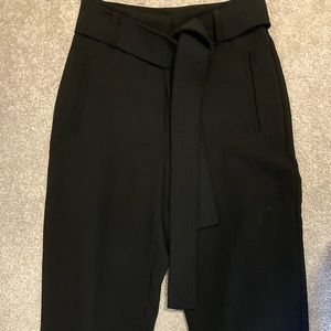 Wilfred size 0, black dress pants never worn. Pet and smoke free home.